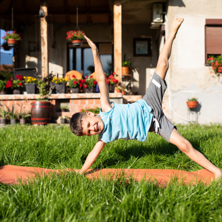YogaExercise Preschooler doing yoga and exercise outdoors